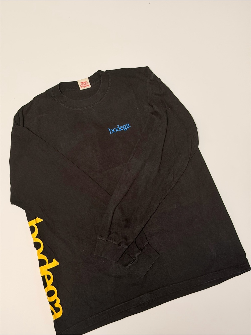 Bodega Black Long Sleeve Tee with Blue and Yellow Logo